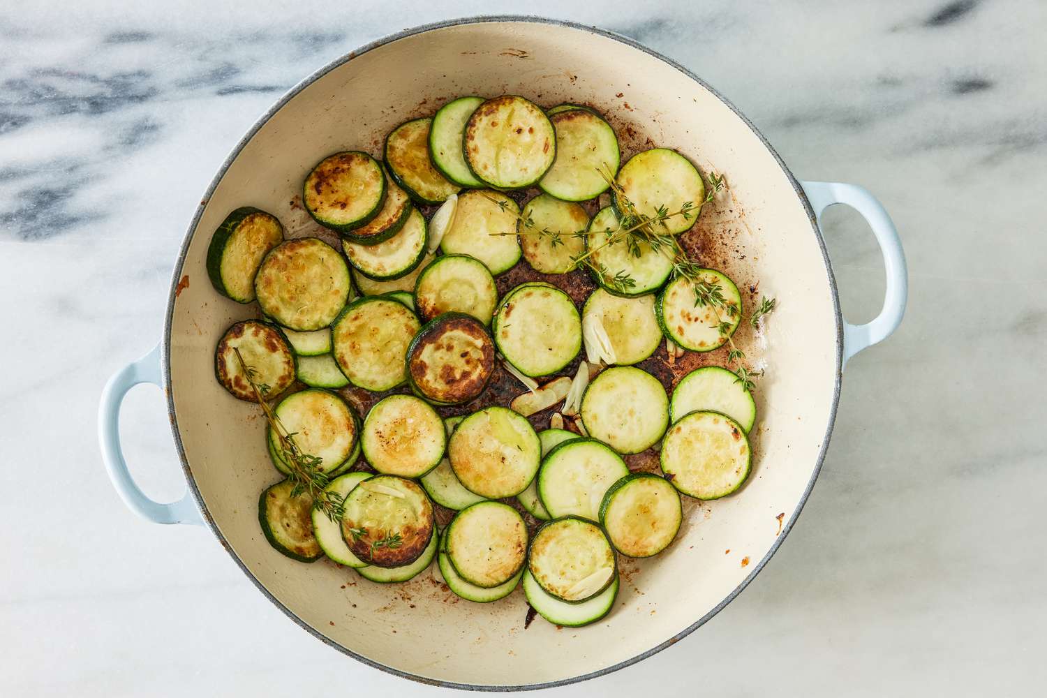 pan-fried zucchini in the dutch oven (after shallots are removed) for crispy chicken thighs with zucchini and shallots recipe