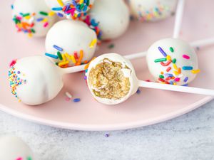 Cake Pops on Plate with One Partially Eaten