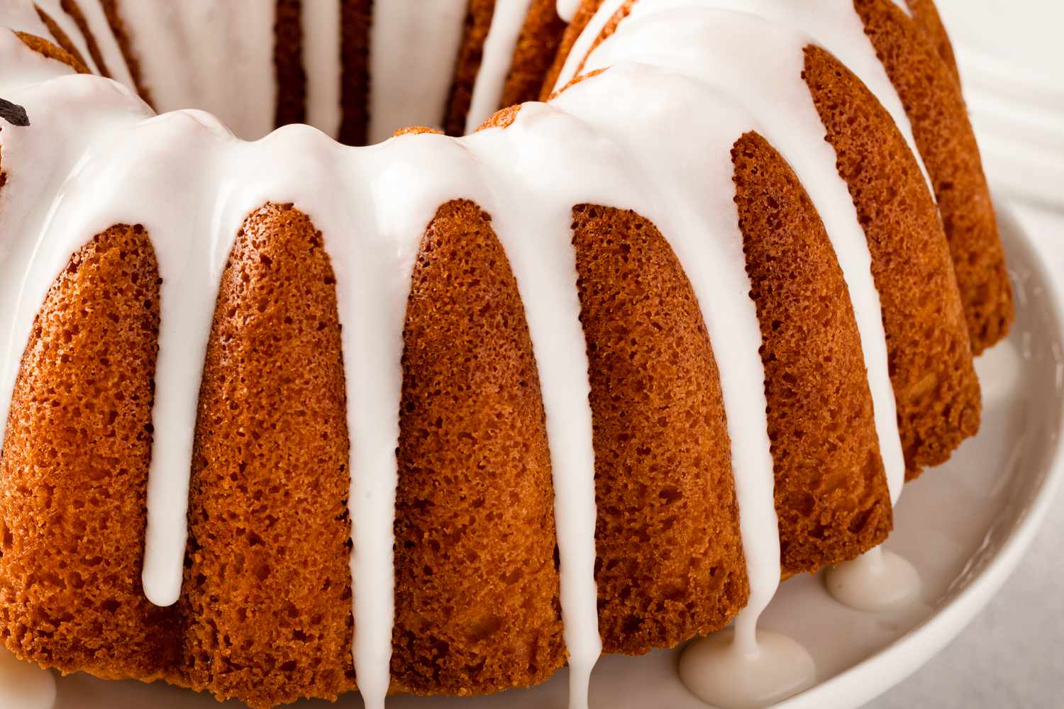 Vanilla bundt cake drizzled with a white glaze