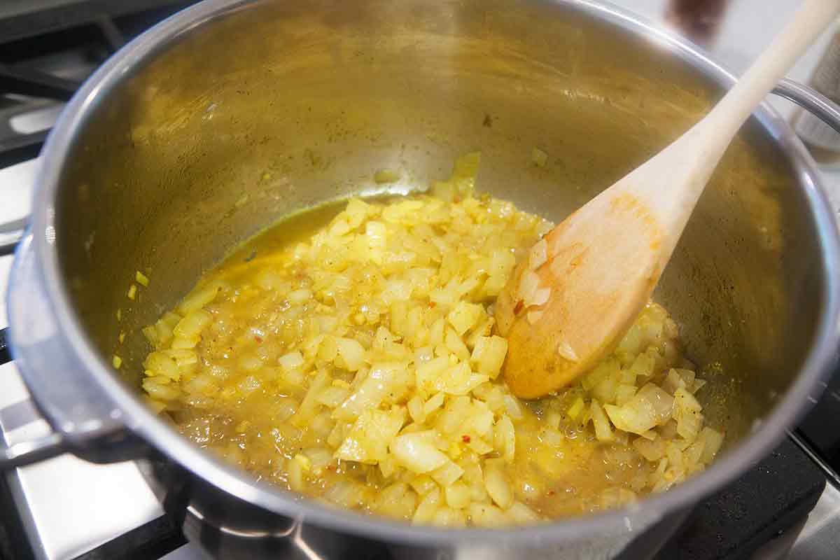 Onions sautéing in a pot