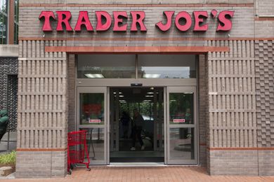 Entrance to a Trader Joes store with shopping carts nearby