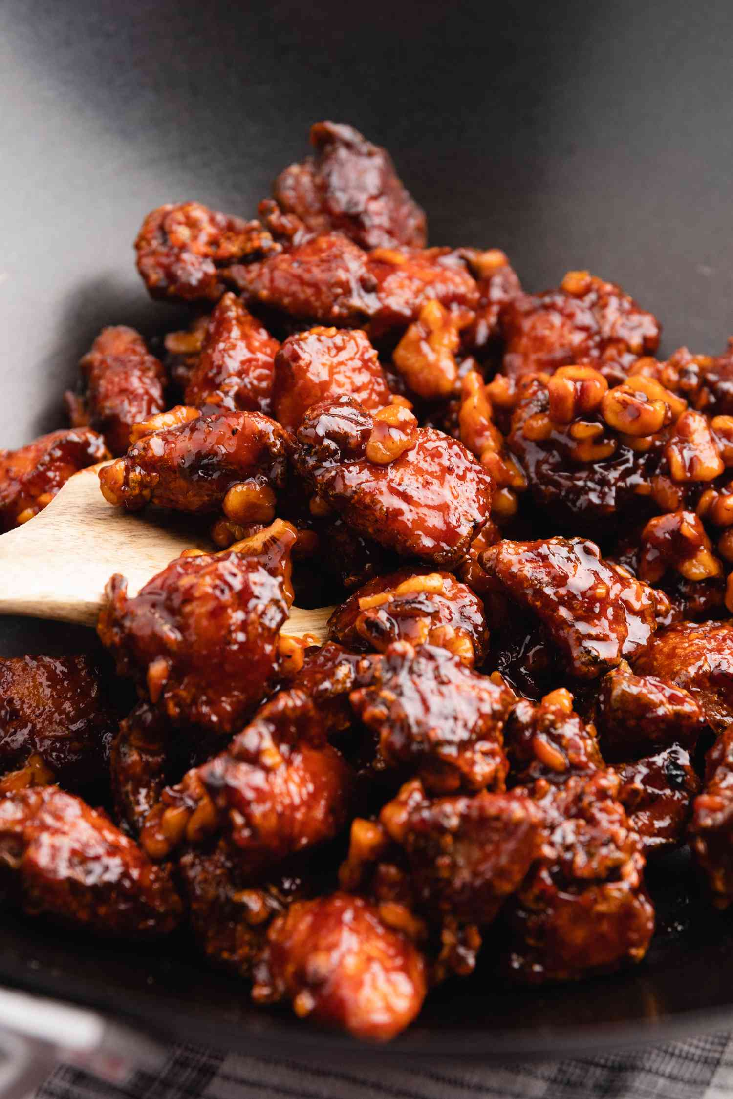 Korean fried chicken with gochujang sauce in wok.