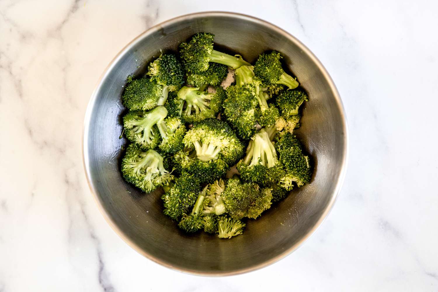 Broccoli florets in a bowl.