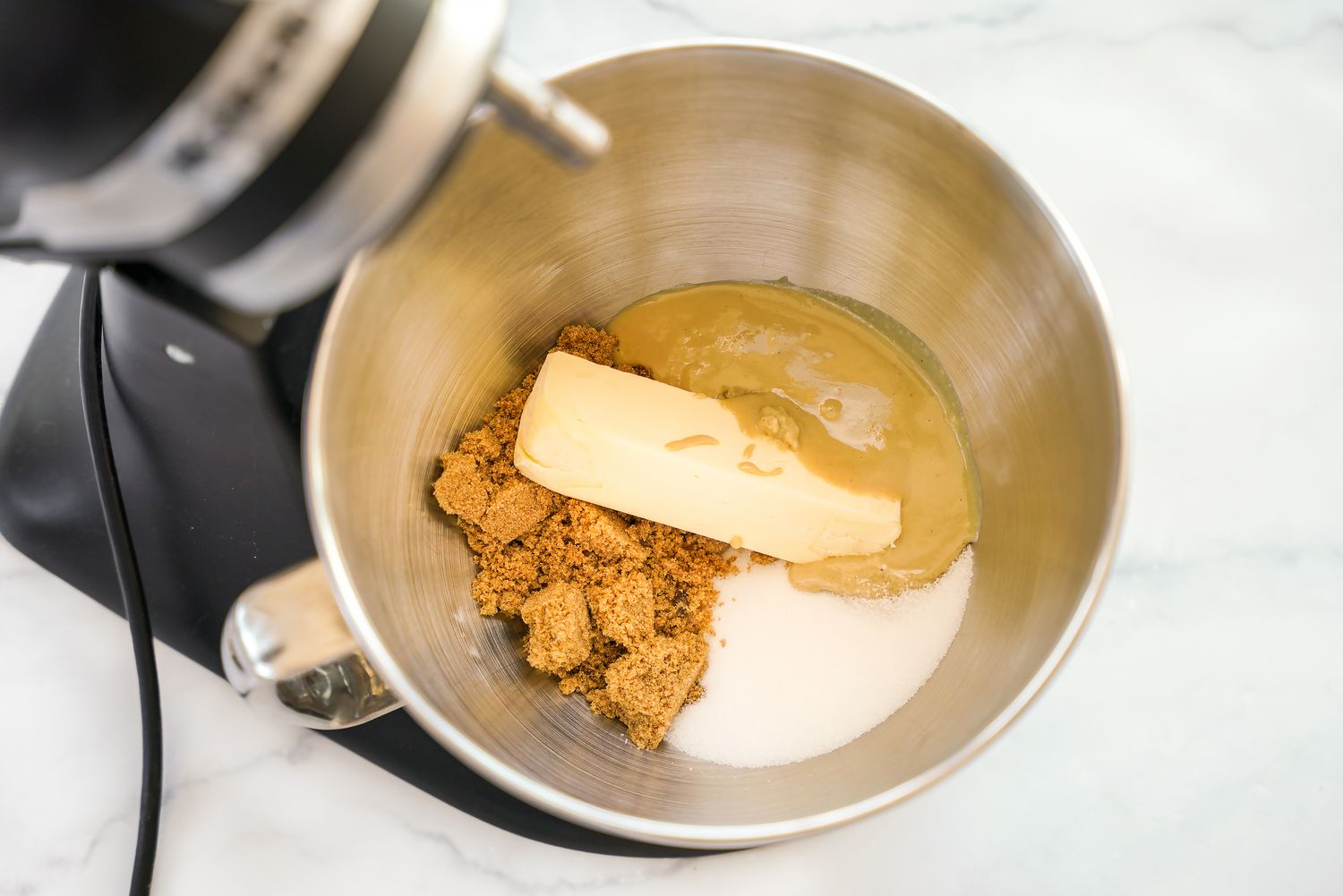 Cream butter, tahini, and sugar