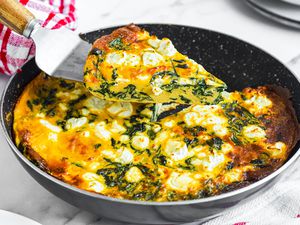 Spinach Frittata Raised from Pan with More Frittata