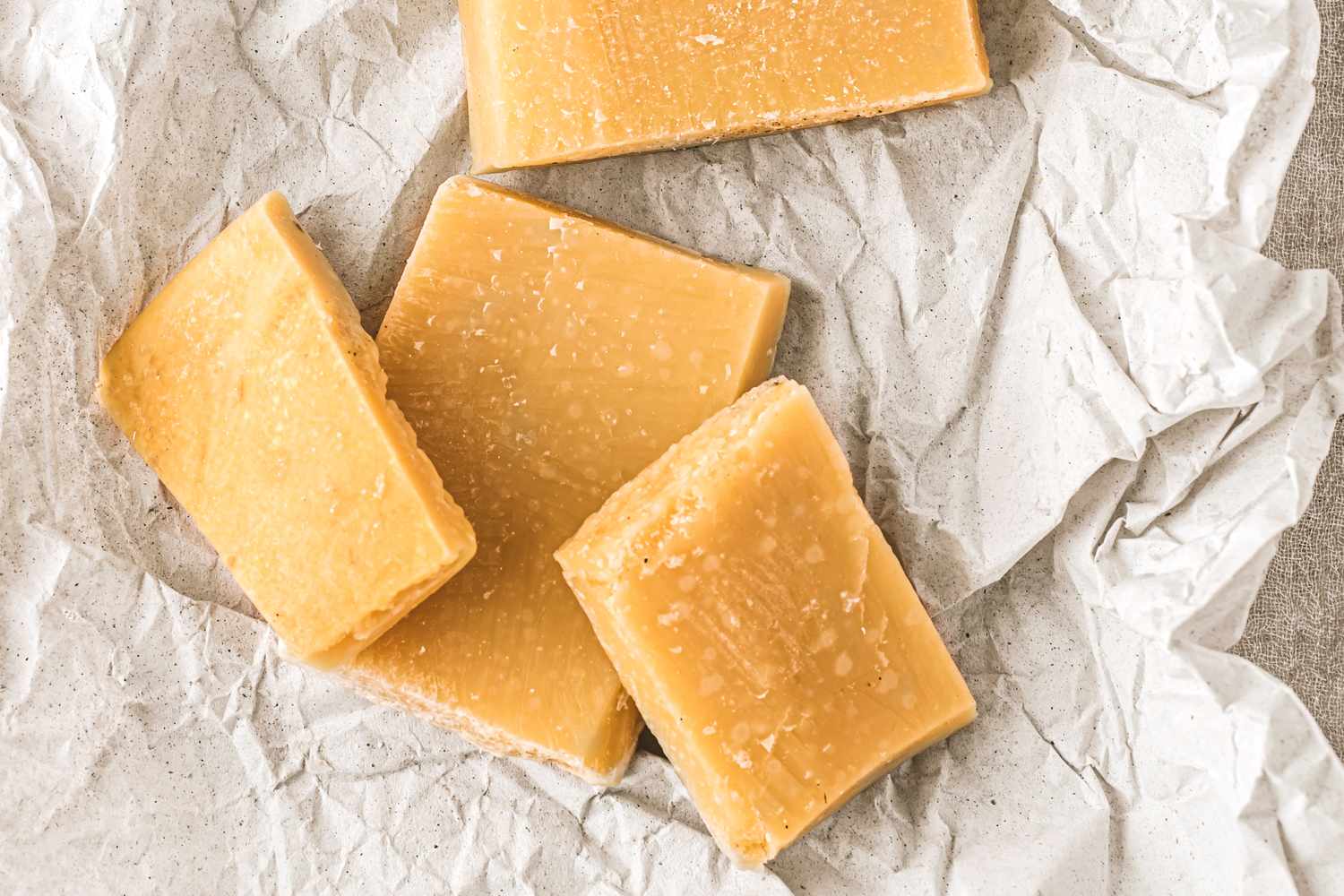 Chunks of cheese on parchment paper