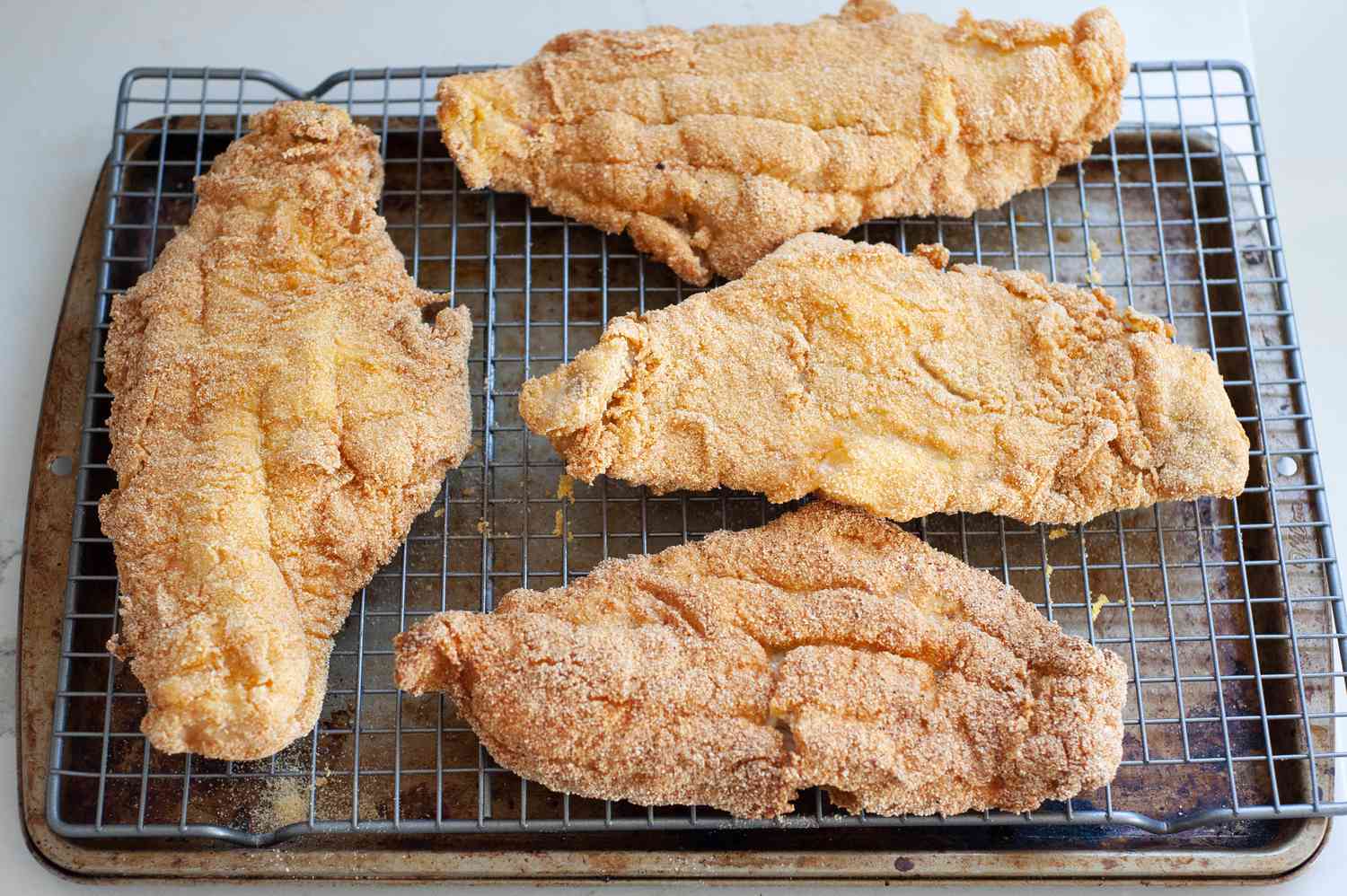 Fried fish on baking rack for Fish Po' Boy