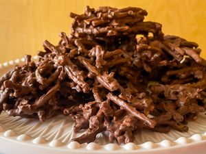 Pile of chocolatecoated pretzel clusters on a plate