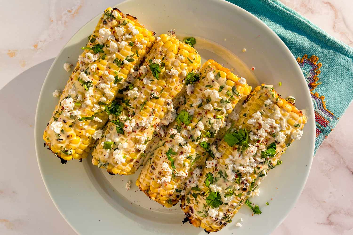 plate of elote (Mexican grilled street corn)