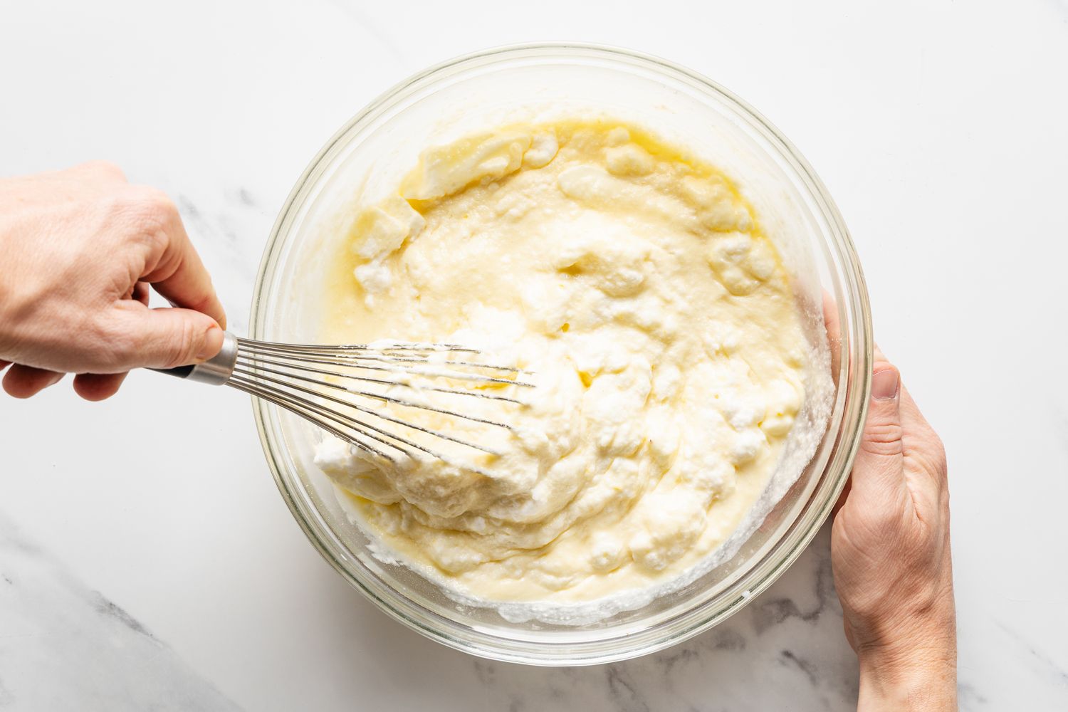 Overhead view of a whisk mixing the filling for Magic Lemon Pie recipe