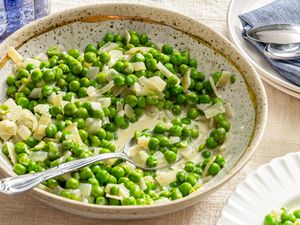Creamed Peas in a bowl with a spoon