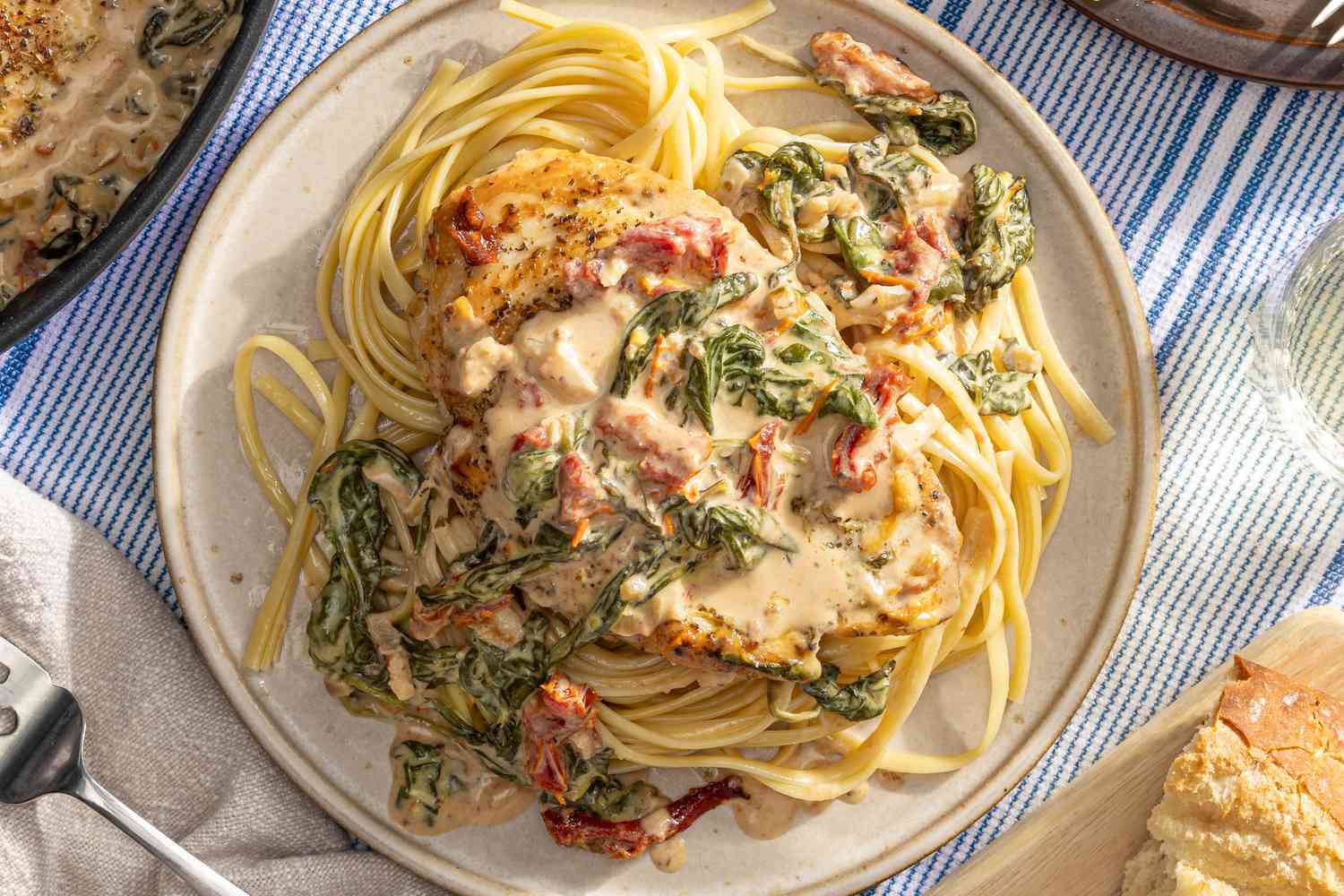 Tuscan chicken on noodles