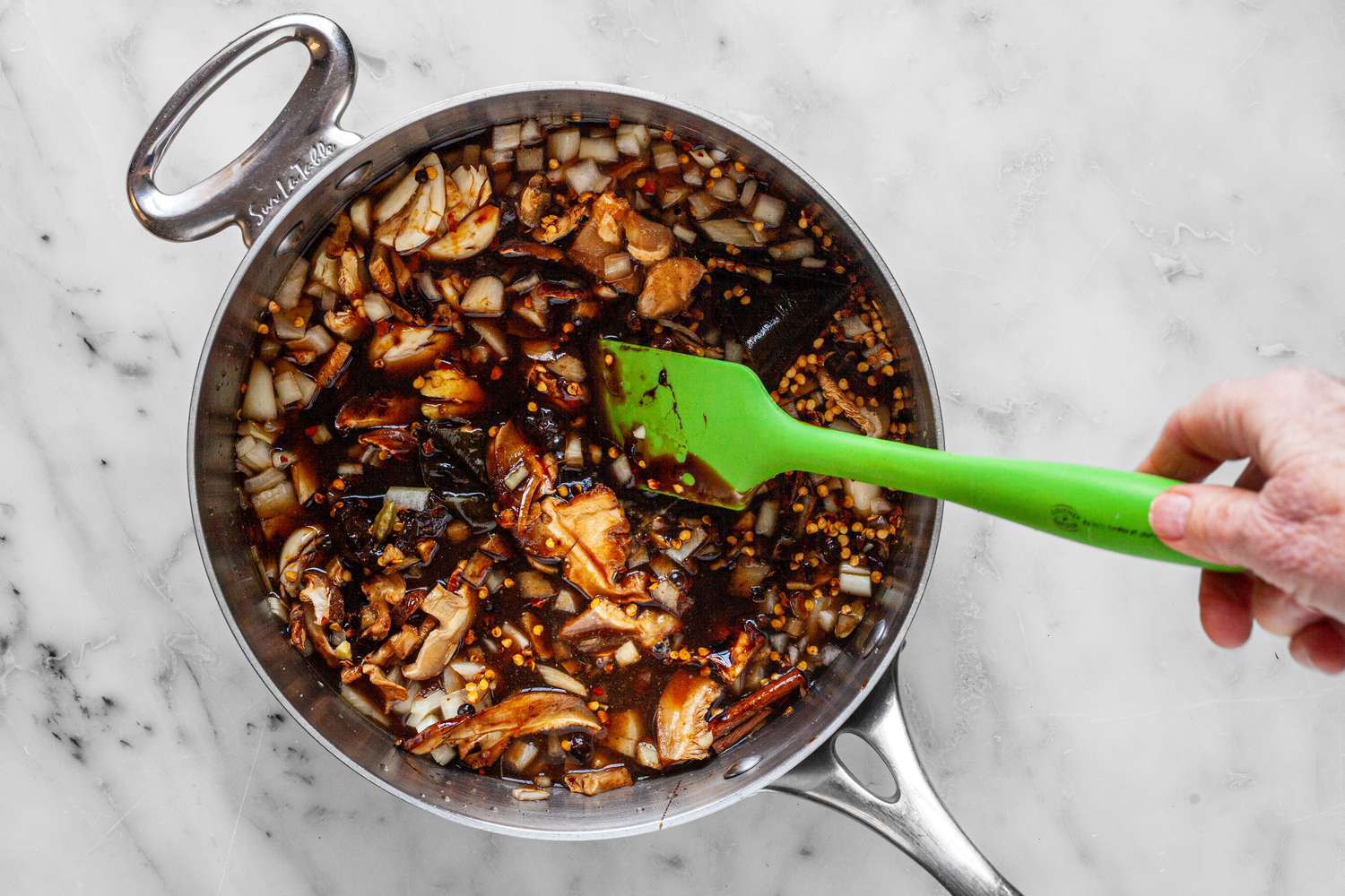 Ingredients Stirred Together in a Pot with a Spatula for Worcestershire Sauce Recipe