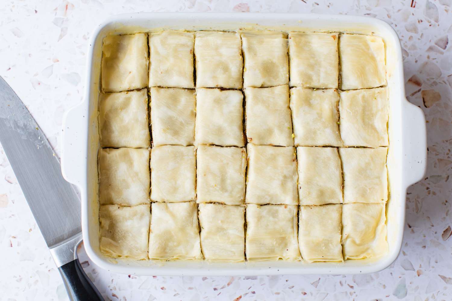 Phyllo Dough Covering Filling Layers and Scored into Individual Pieces for Baklava Recipe