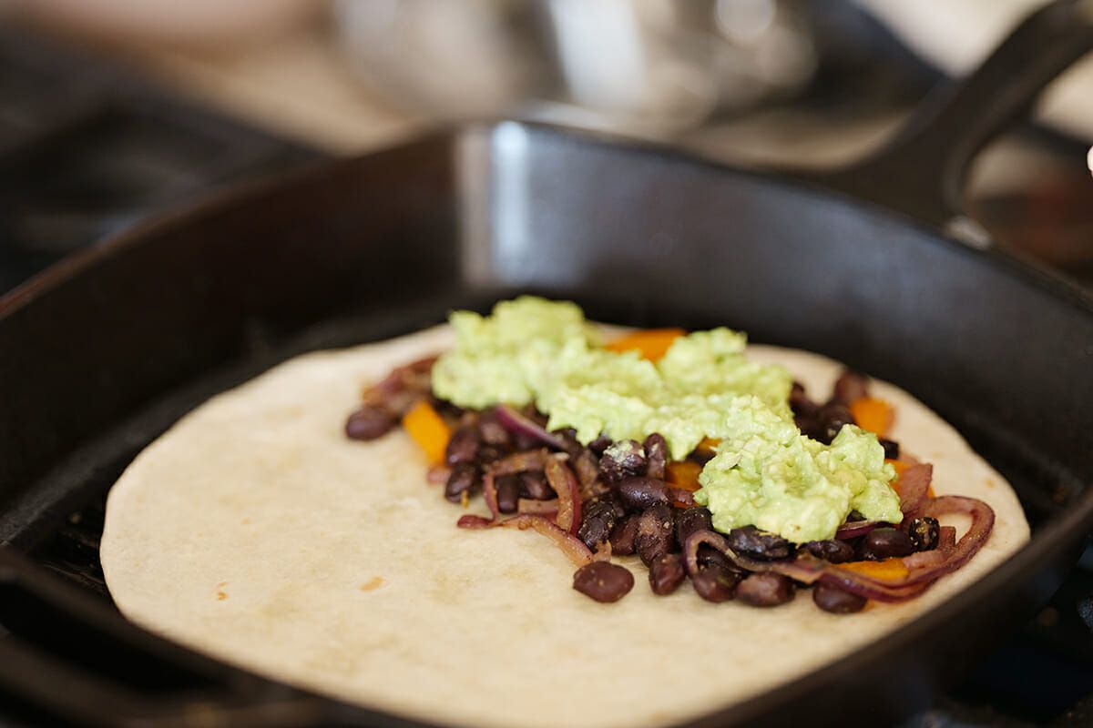 Avocado Quesadilla add the beans and avocado
