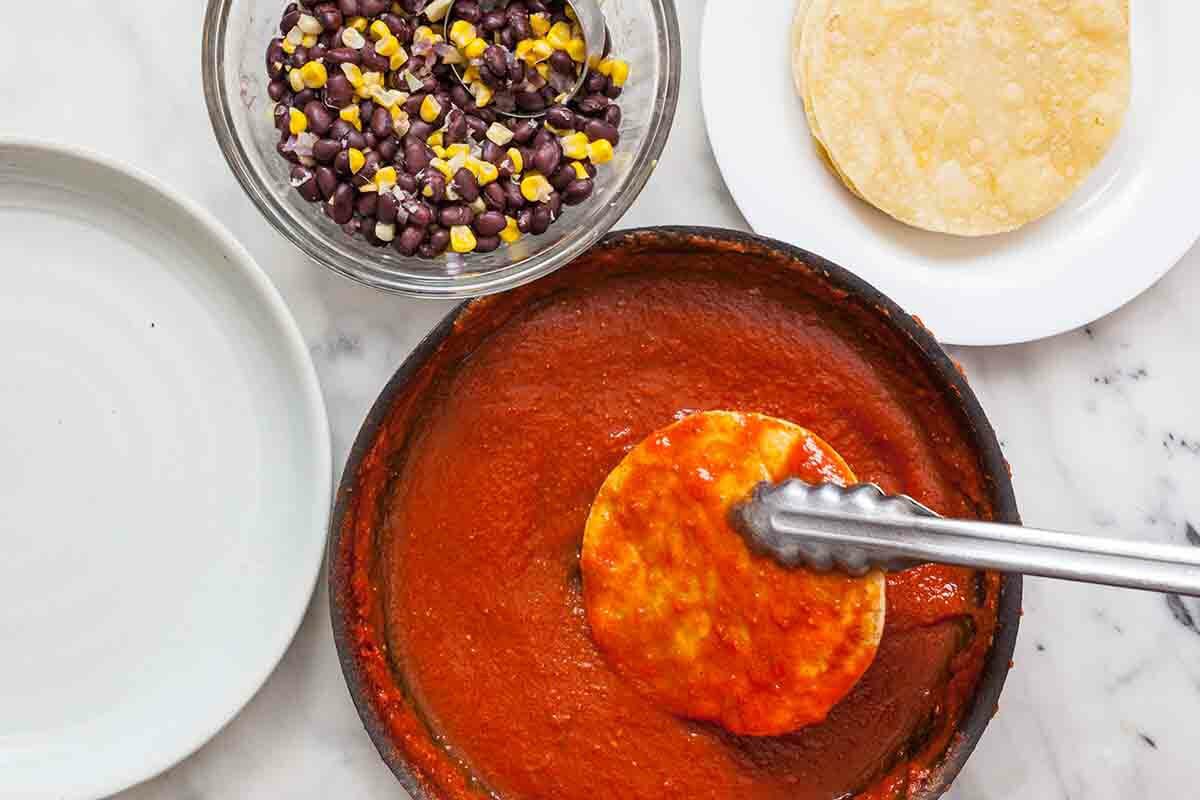 Vegetarian Enchilada Stack dip the tortilla in the sauce