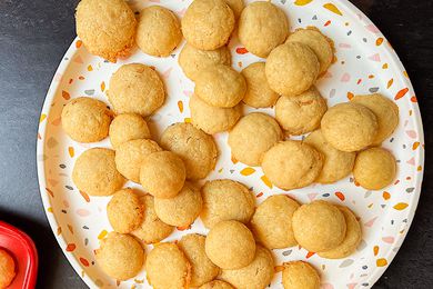 Homemade cheese puffs on a large serving plate