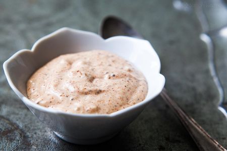 Remoulade Sauce in a white bowl with a spoon