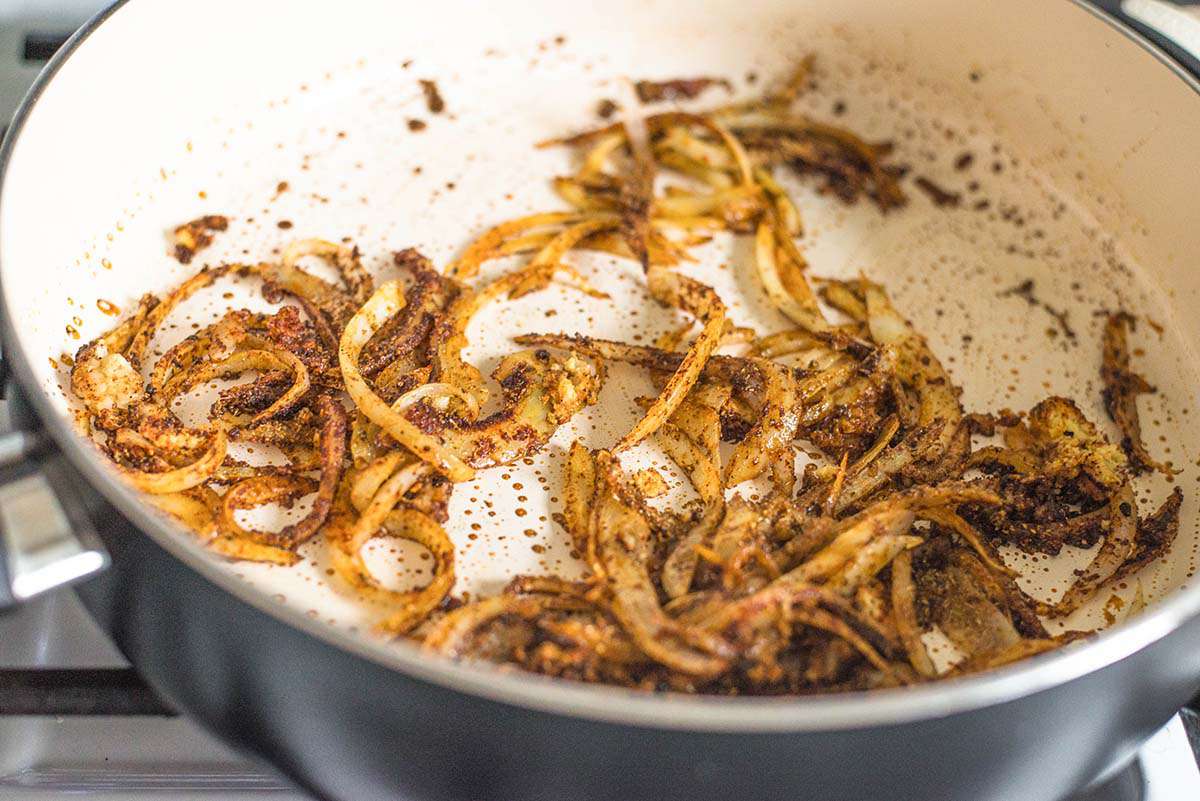 Chicken Tikka Masala Toasting spices for chicken tikka masala with the onions