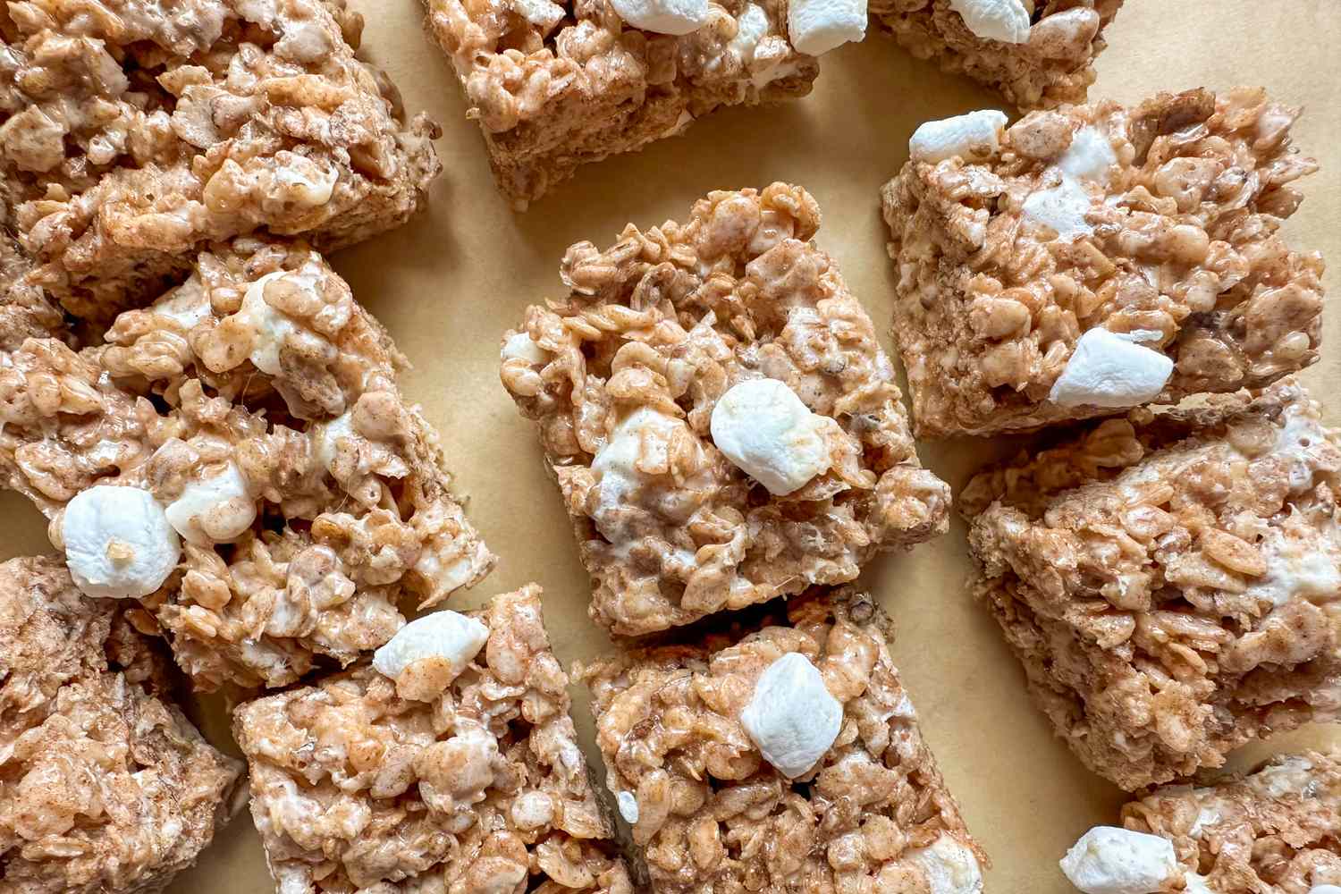 Cinnamon flavored crispy rice treats with marshmallows on a surface