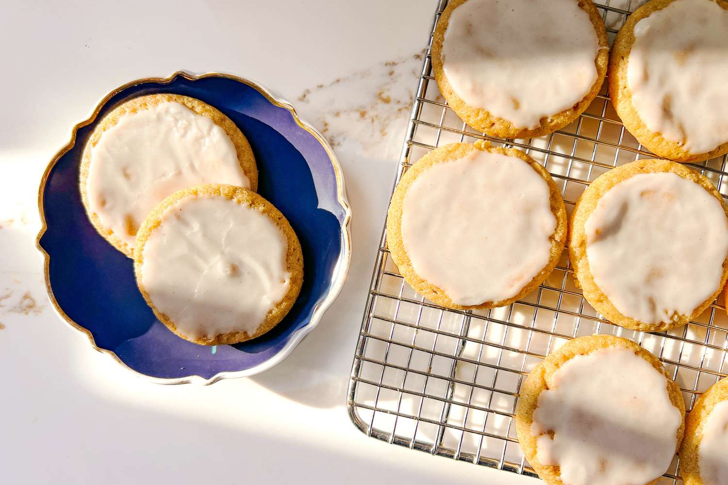 Taylor Swift Cookies on a blue plate and rack