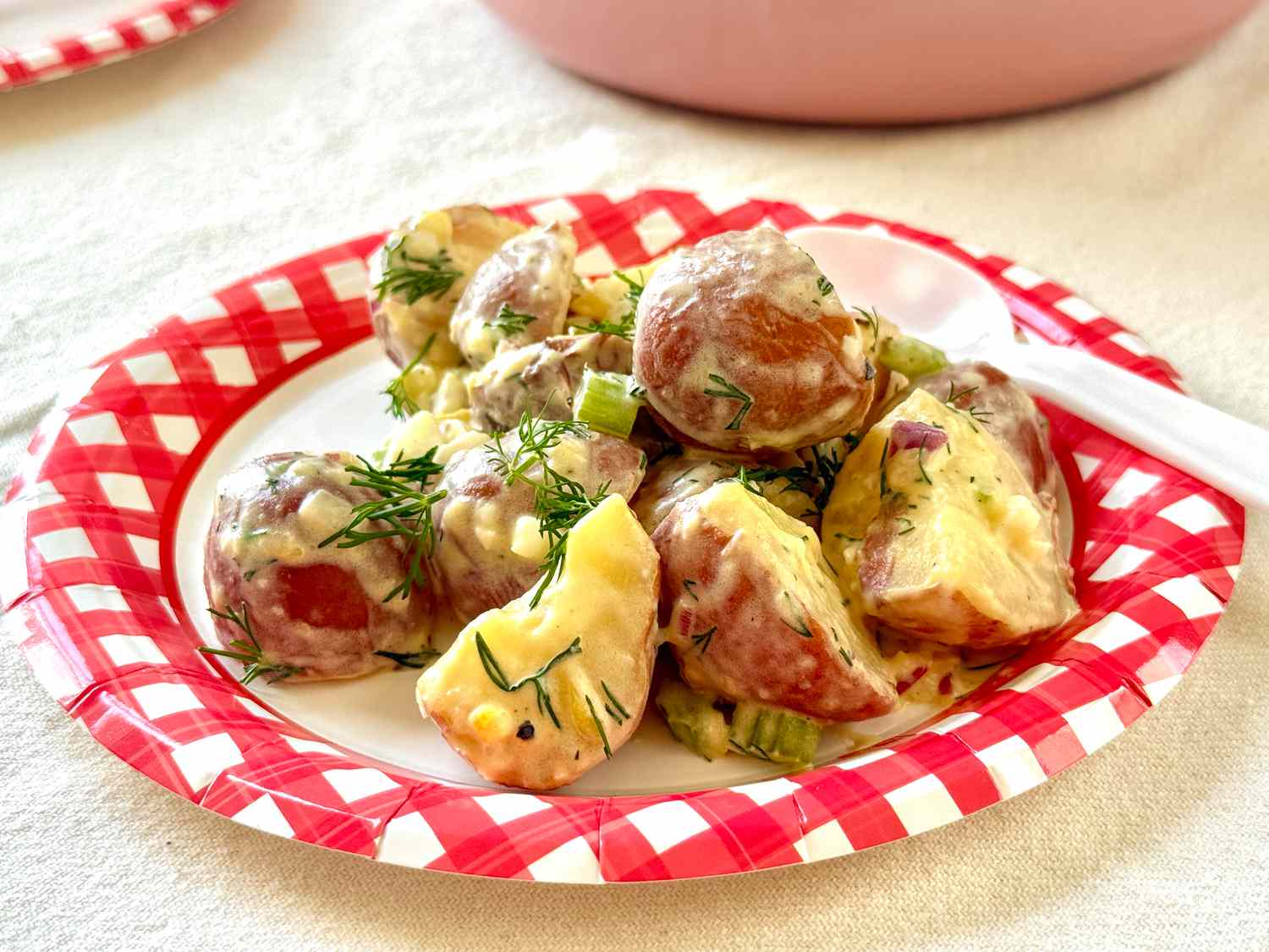 Potato salad with herbs on a decorative plate