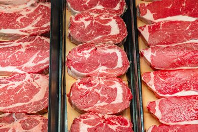 Display of fresh cuts of beef on a butchers counter
