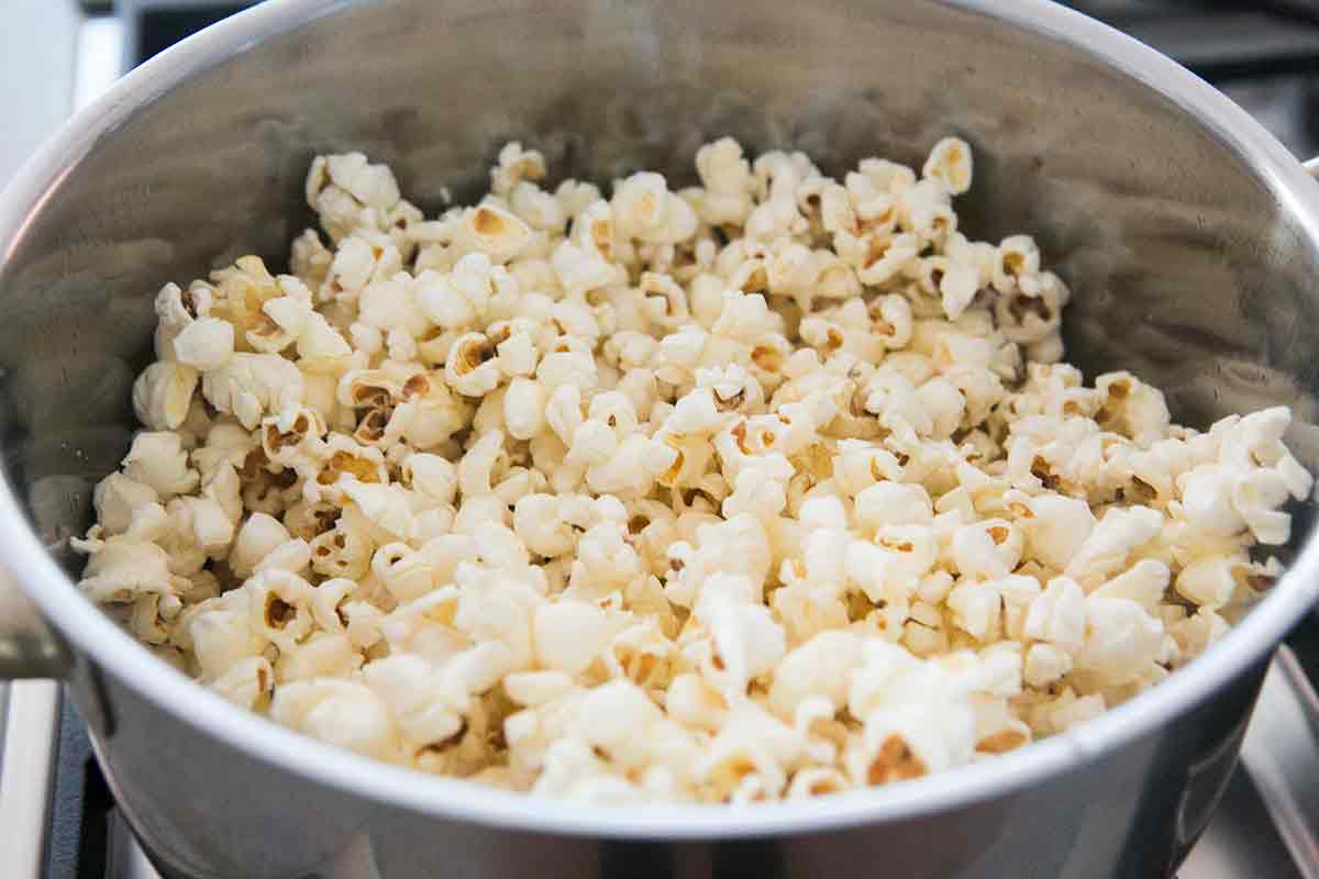 once the popcorn stops popping, remove the pot from heat