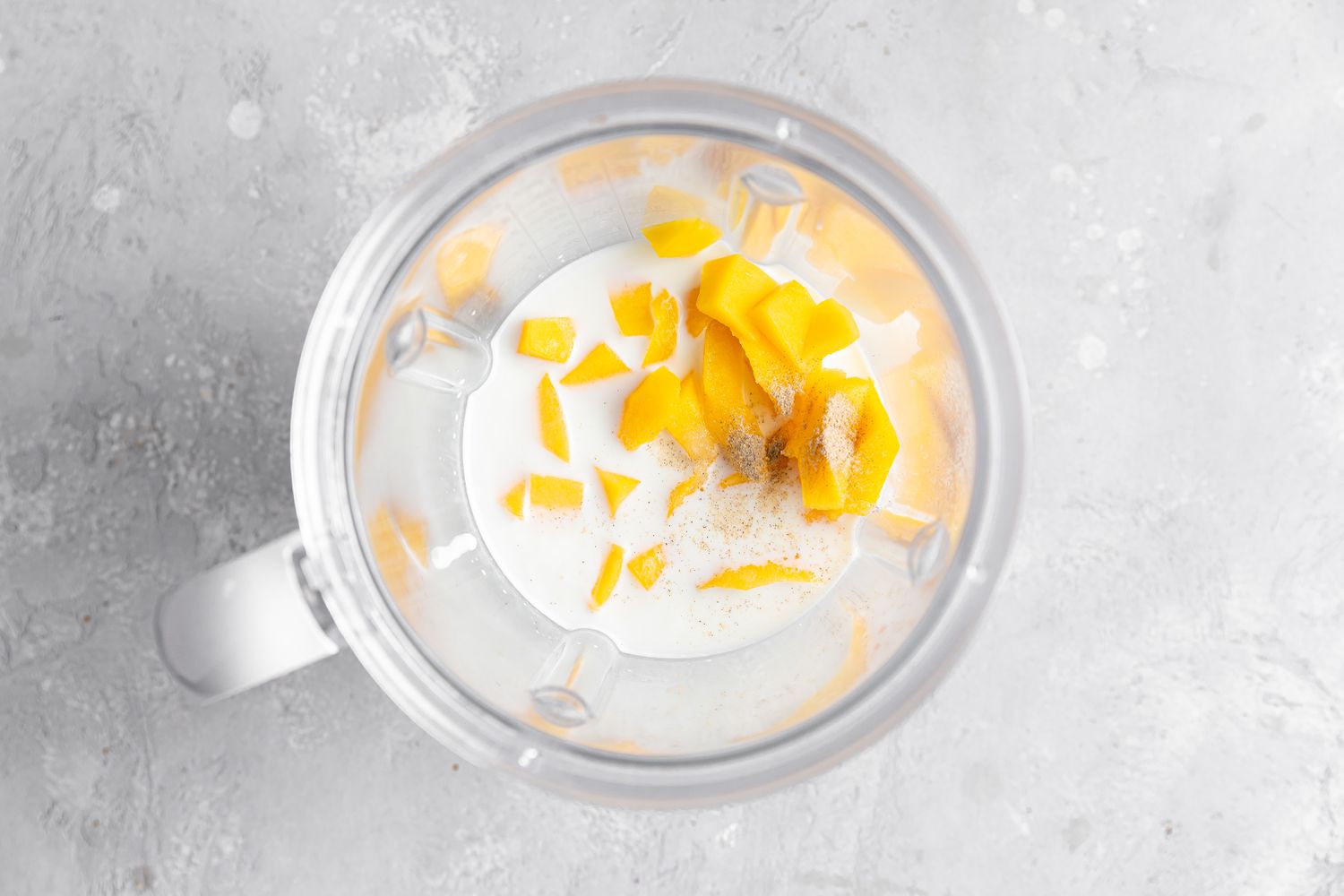 Mango and Milk in Blender for Mango Lassi Recipe