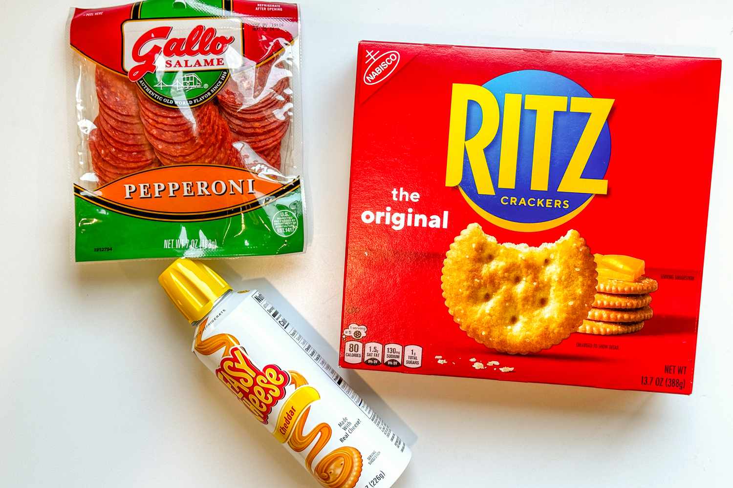 The ingredients: a box of Ritz crackers, a can of Easy Cheese, and a bag of pepperoni