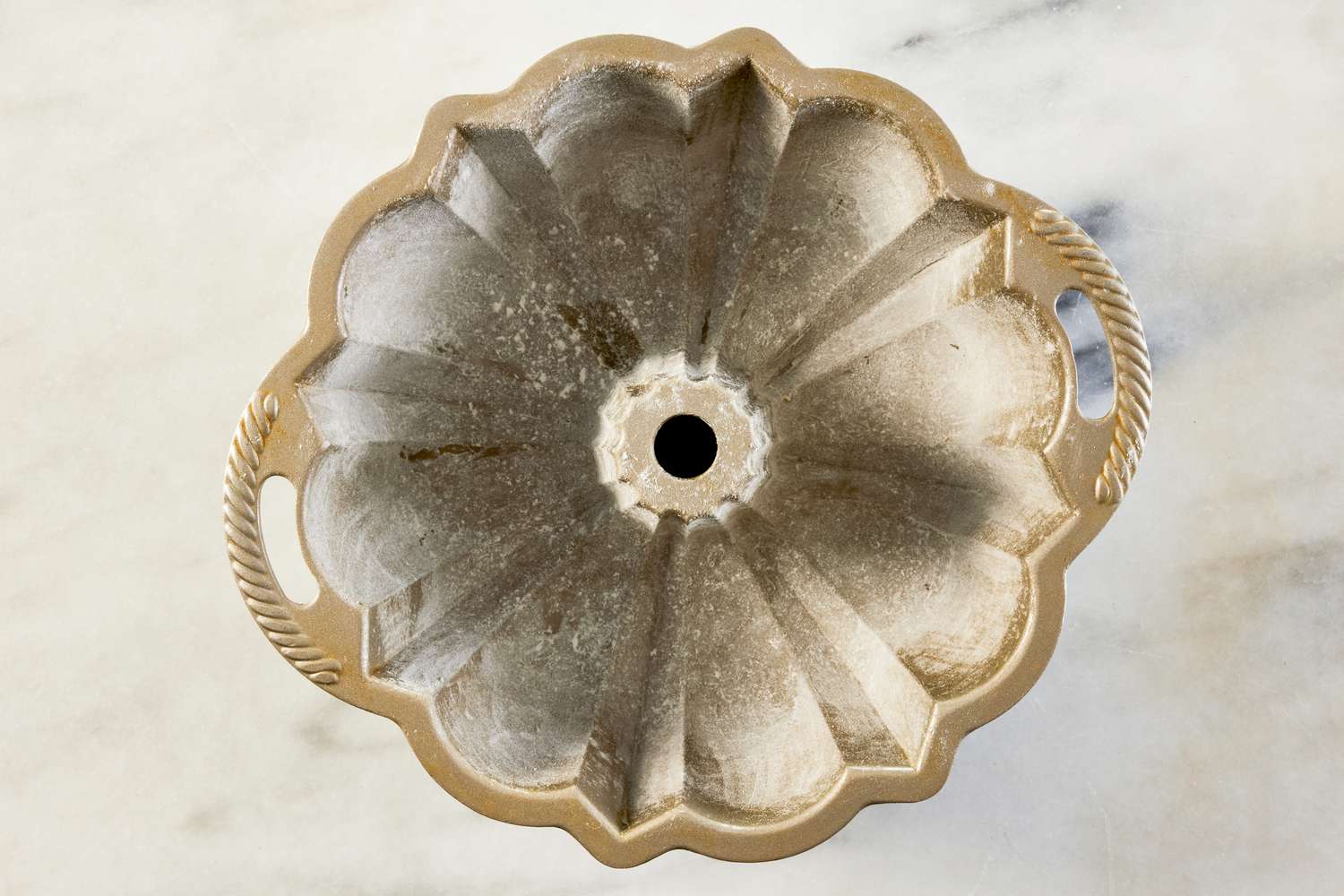 bundt pan coated with flour for 7UP bundt cake recipe