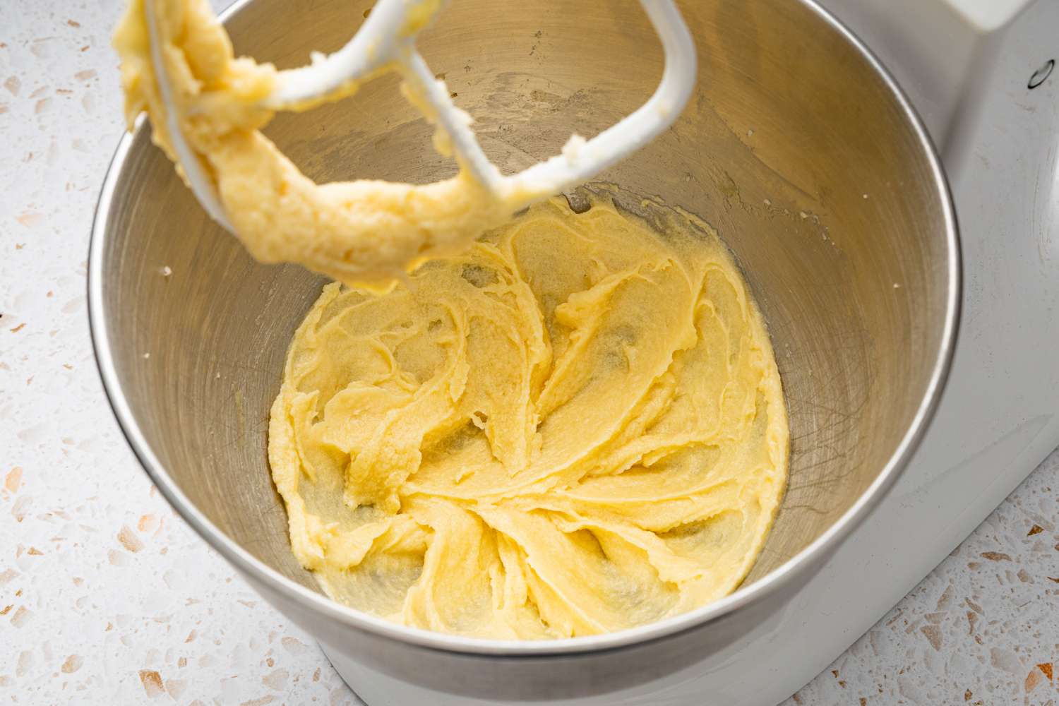Egg Whisked into Creamed Sugar and Butter Mixture in a Stand Mixer for Blueberry Muffin Tops Recipe