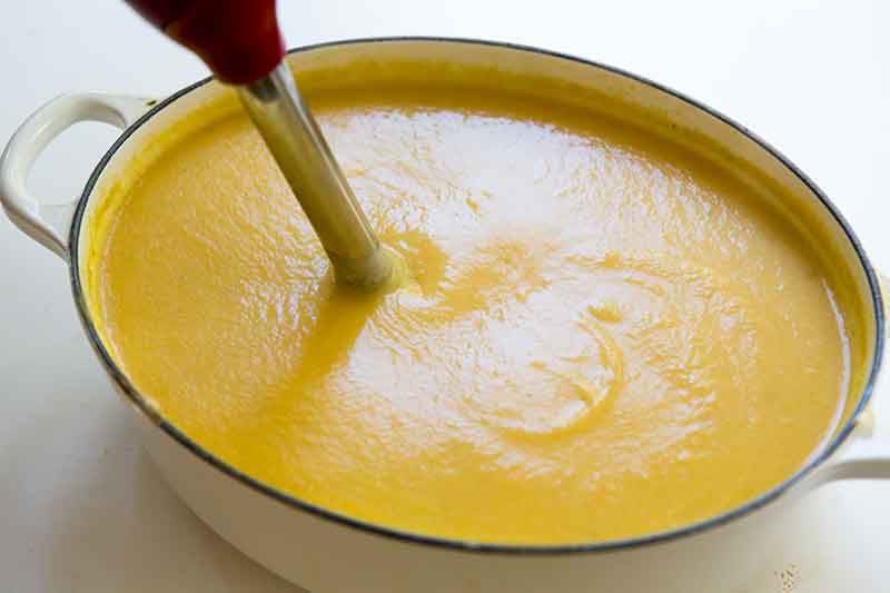Pureed ingredients in cauliflower cheddar soup