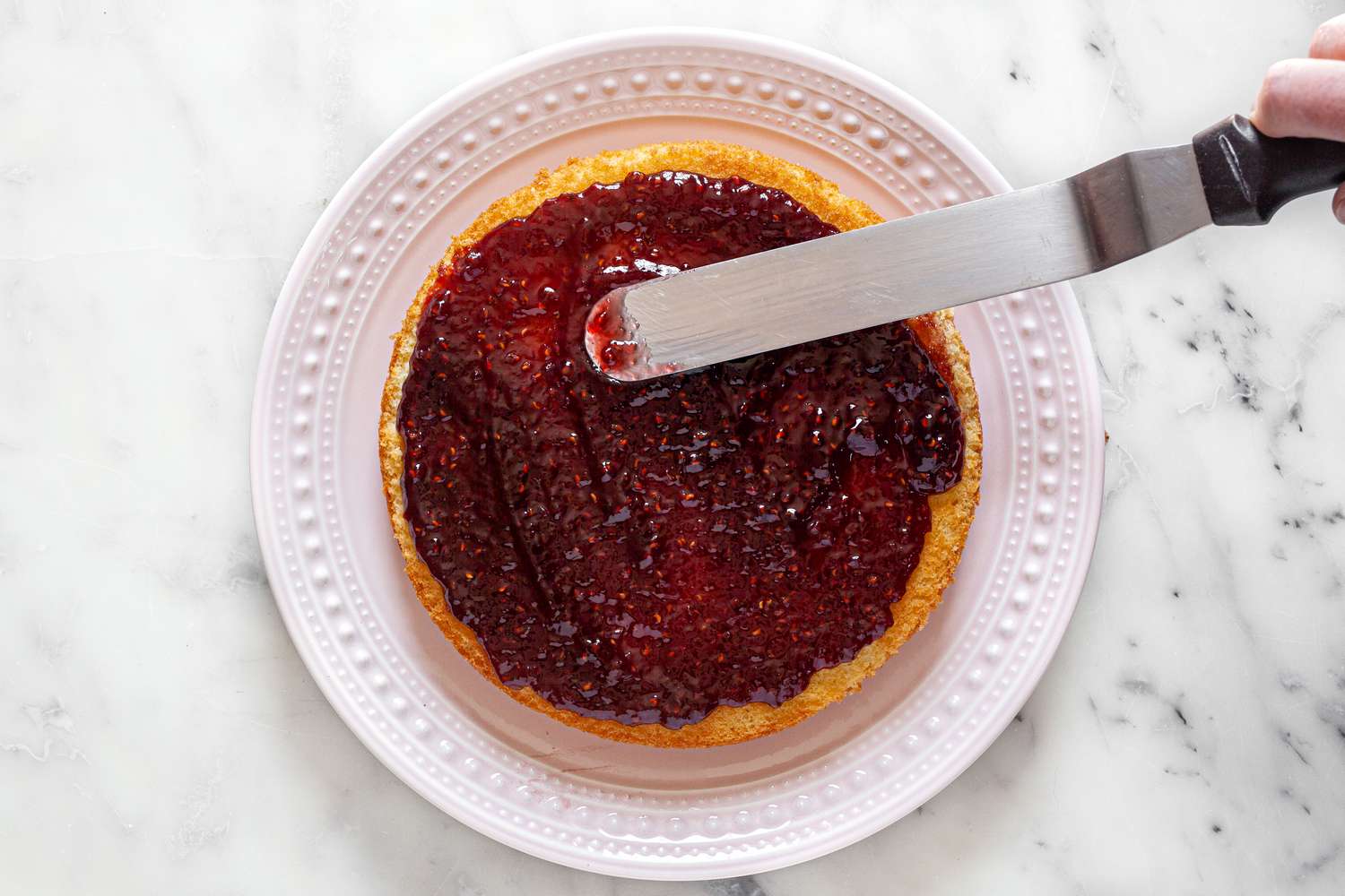 Jam Spread Using Off-Set Spatula on Victoria Sponge Cake