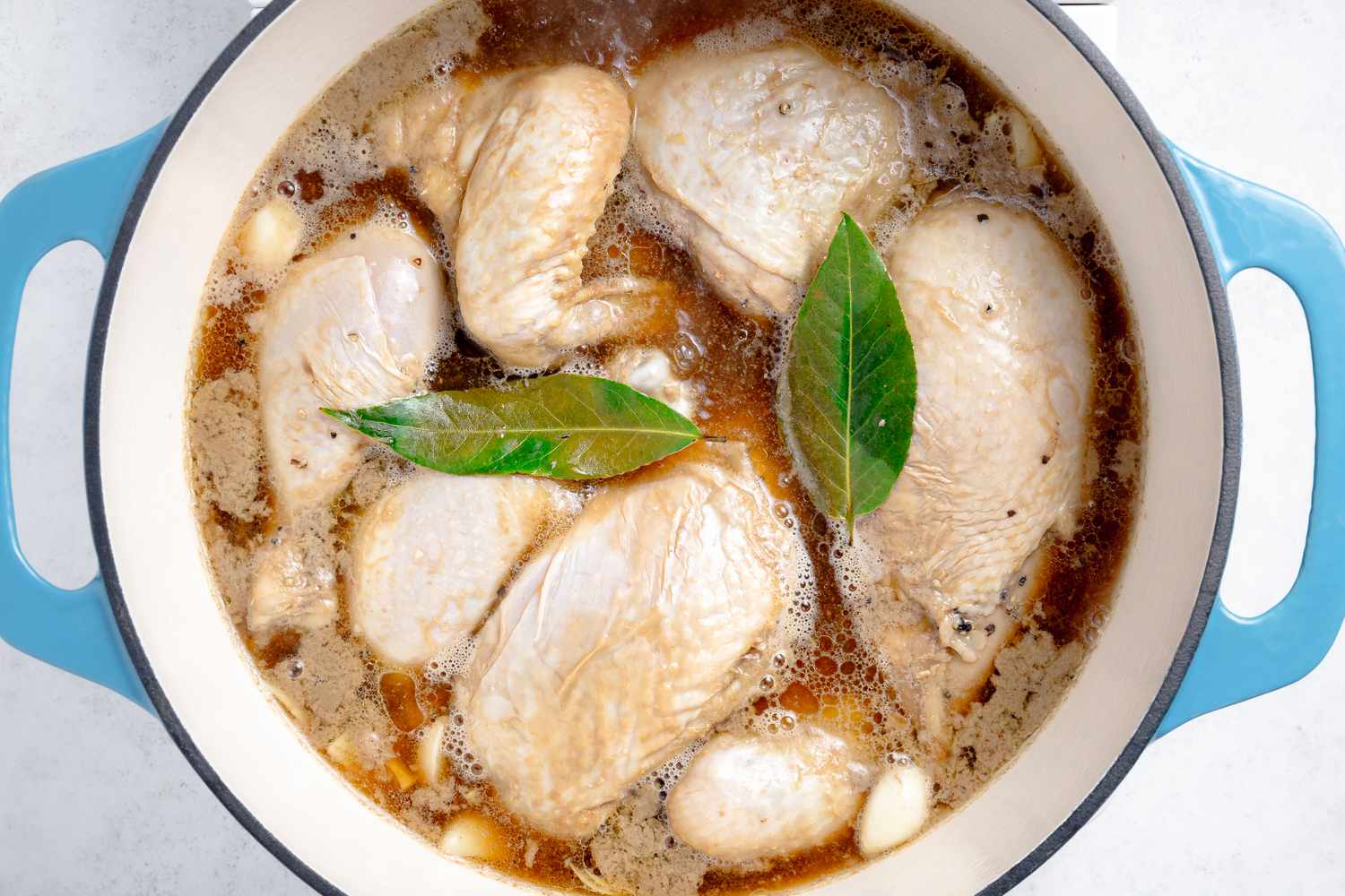 Chicken Adobo Boiling in a Dutch Oven 