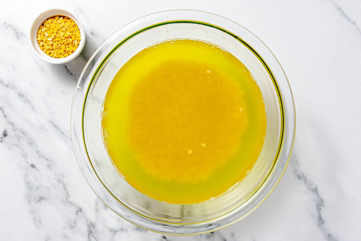 Bowl of Mung Beans Soaking in Water Next to a Smaller Bowl With Dry Mung Beans for ChÃ¨ Ba MÃ u Recipe