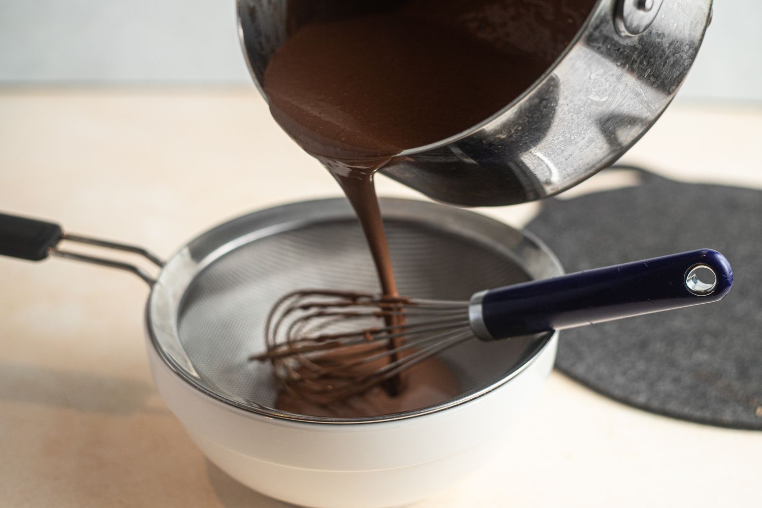 Chocolate Pots de Crème Mixture Poured through a Sieve