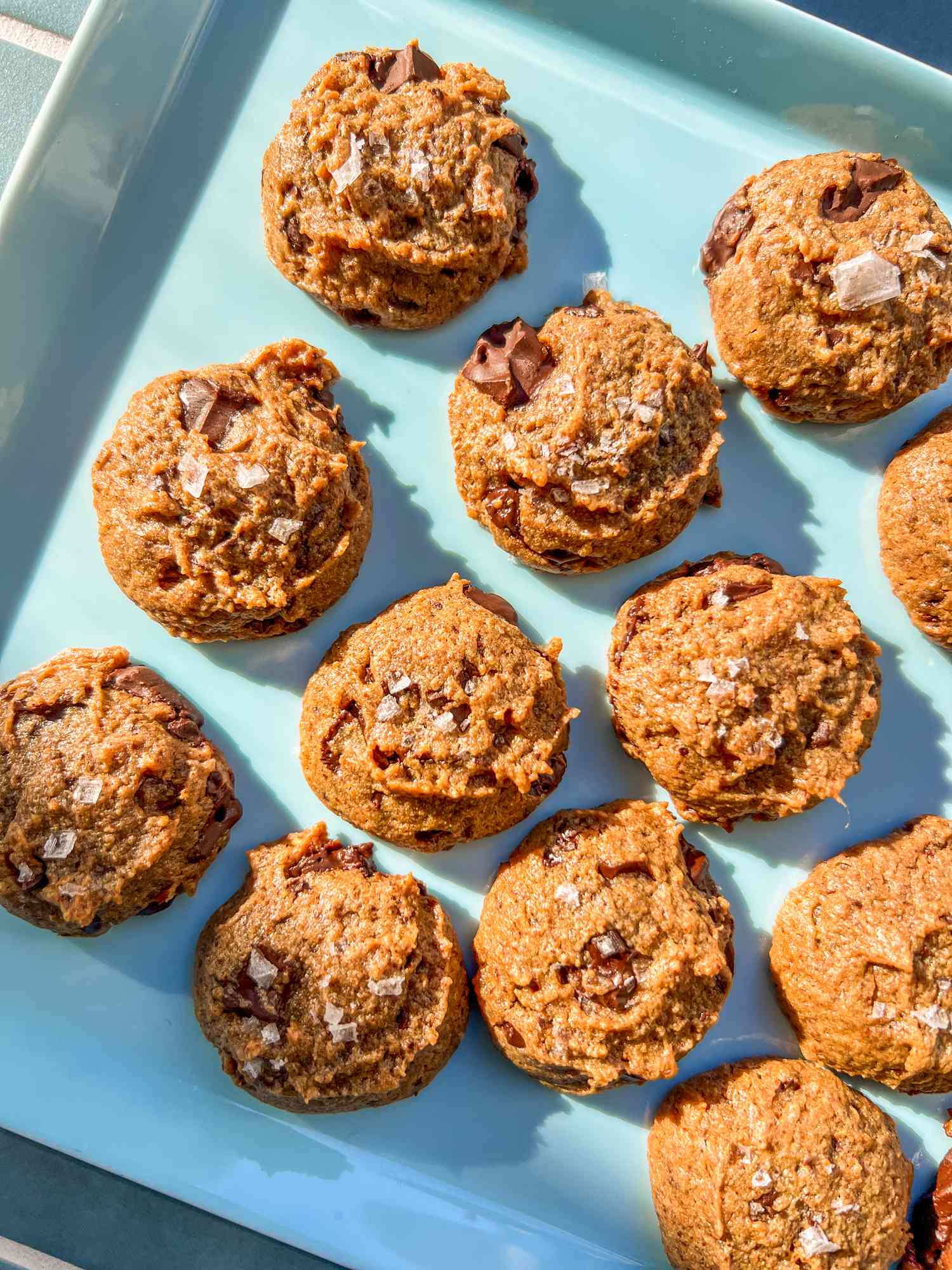 Almond butter cookies on a blue plate. 