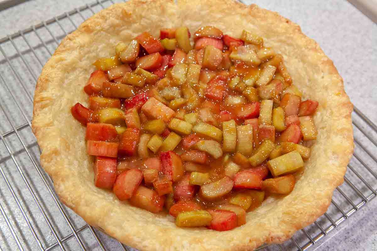 pour rhubarb filling into the pre baked pie shell