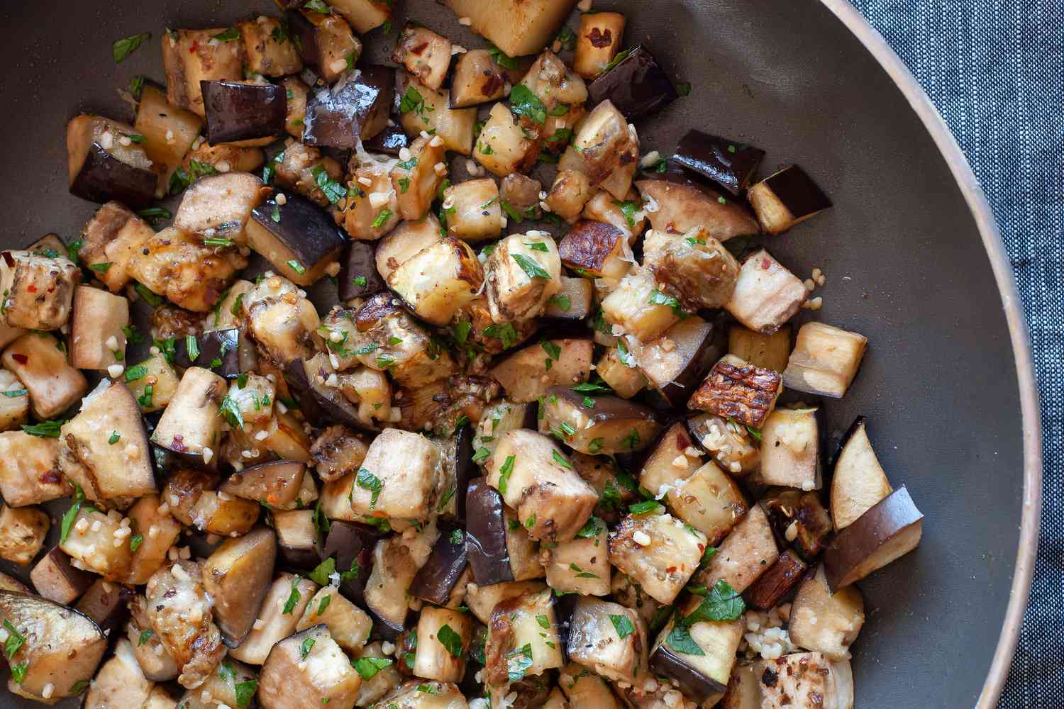Sautéed Eggplant with Garlic and Parmesan in a Skillet