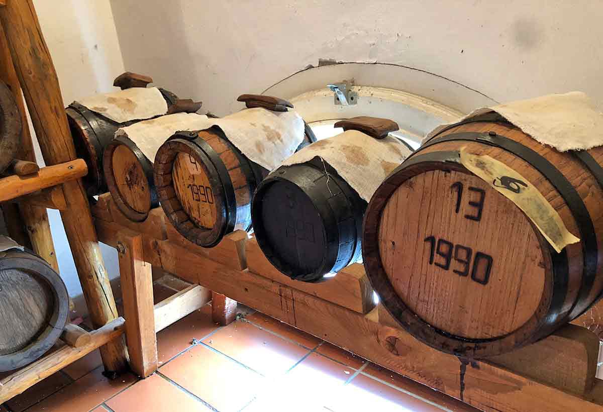 a battery of barrels of traditional balsamic vinegar in a private attic