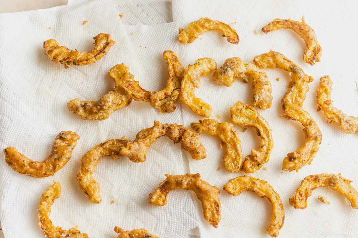 Delicata Squash Pakoras Resting on Paper Towels