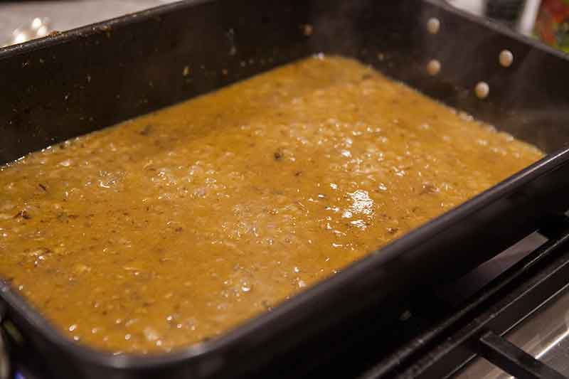 A mixed giblet gravy mixture resting on a baking dish 