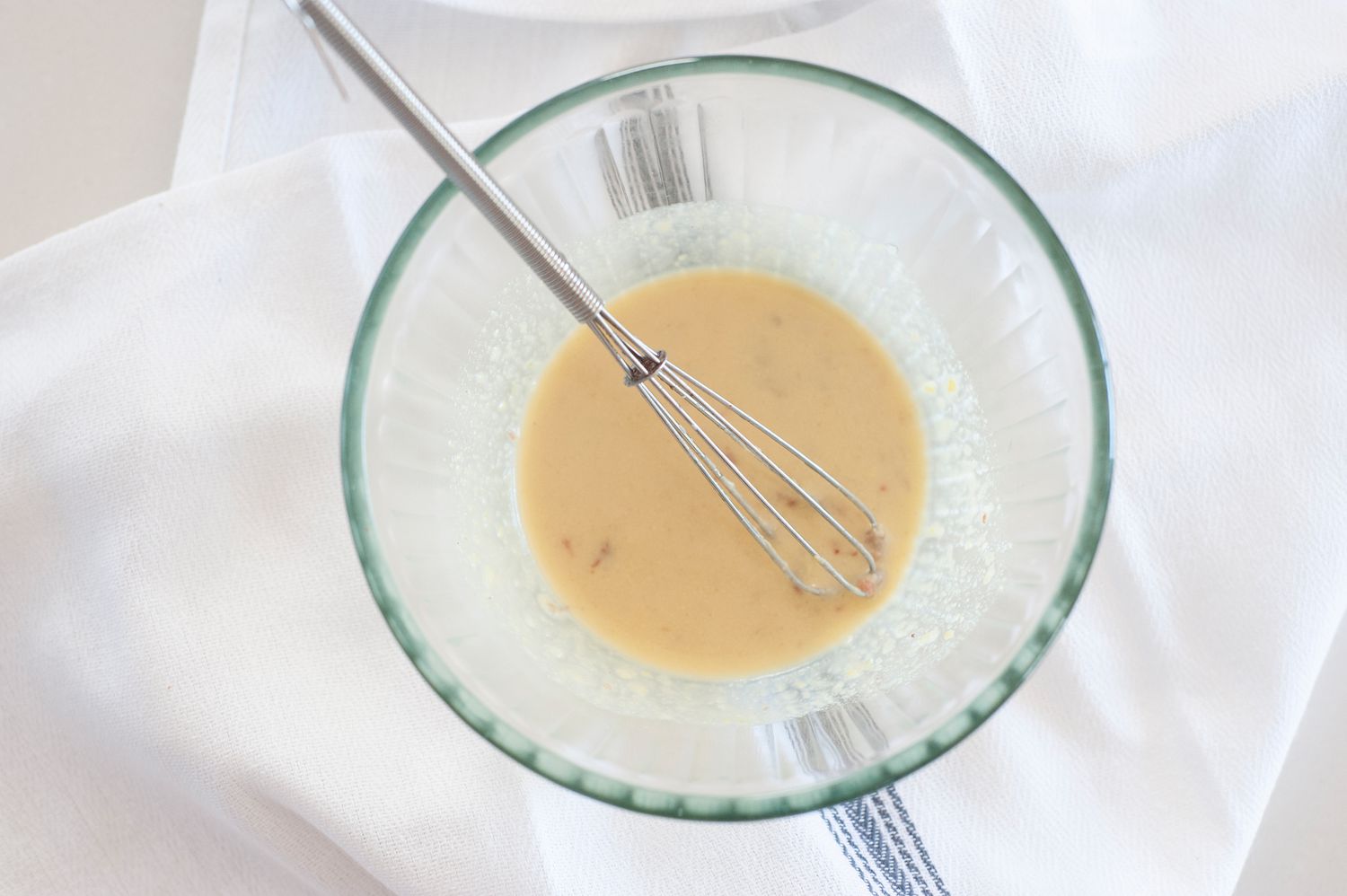 Blended ingredients to make a Basic Dijon Anchovy Vinaigrette.