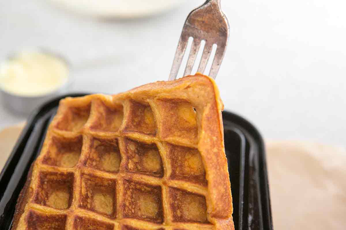 removing cooked pumpkin waffles from waffle iron