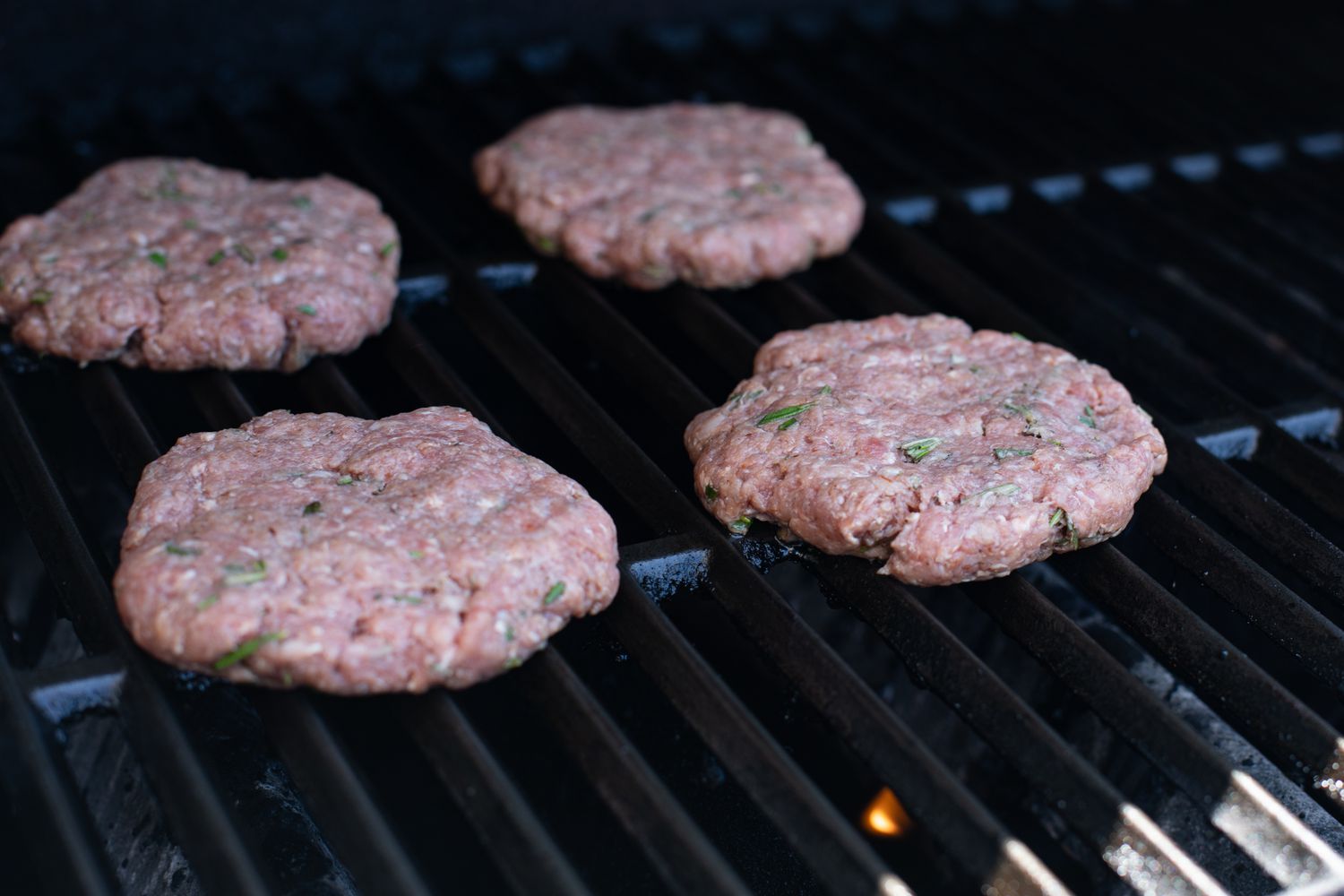 Grilling burgers to make a famous burger.