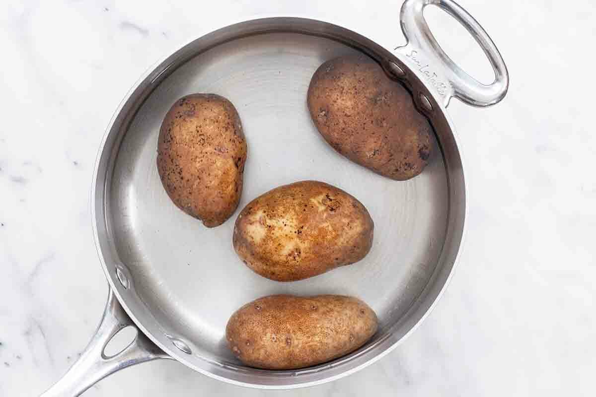 Funeral Potatoes - poach the potatoes