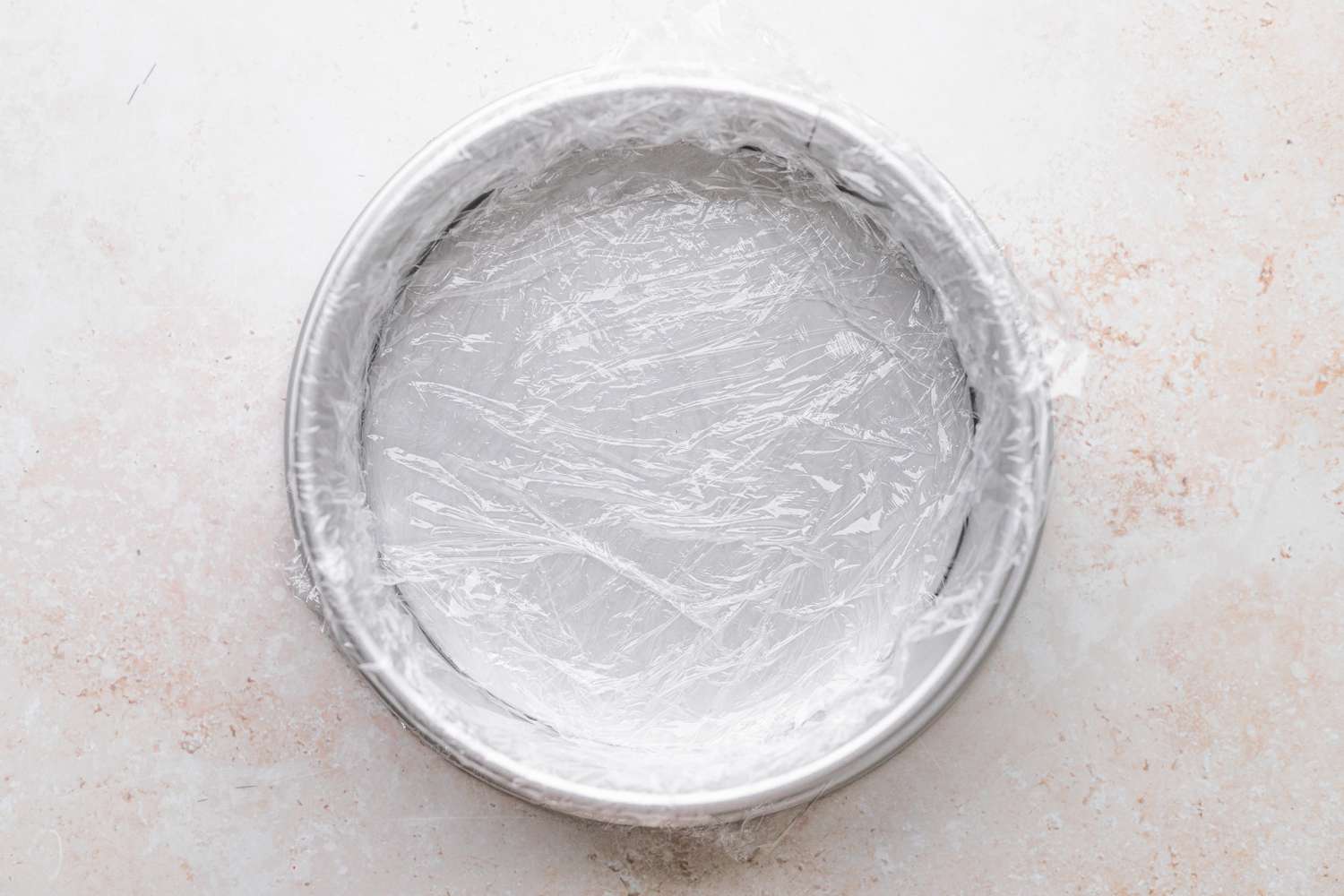 Plastic Wrap in a Cake Tin for Ice Cream Cake Recipe