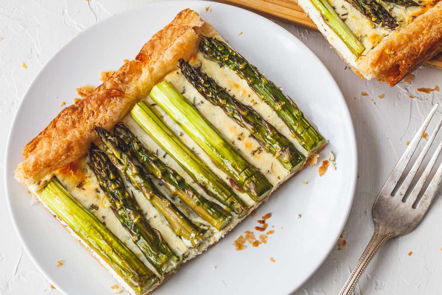 A plate with a slice of Easy Asparagus Tart.