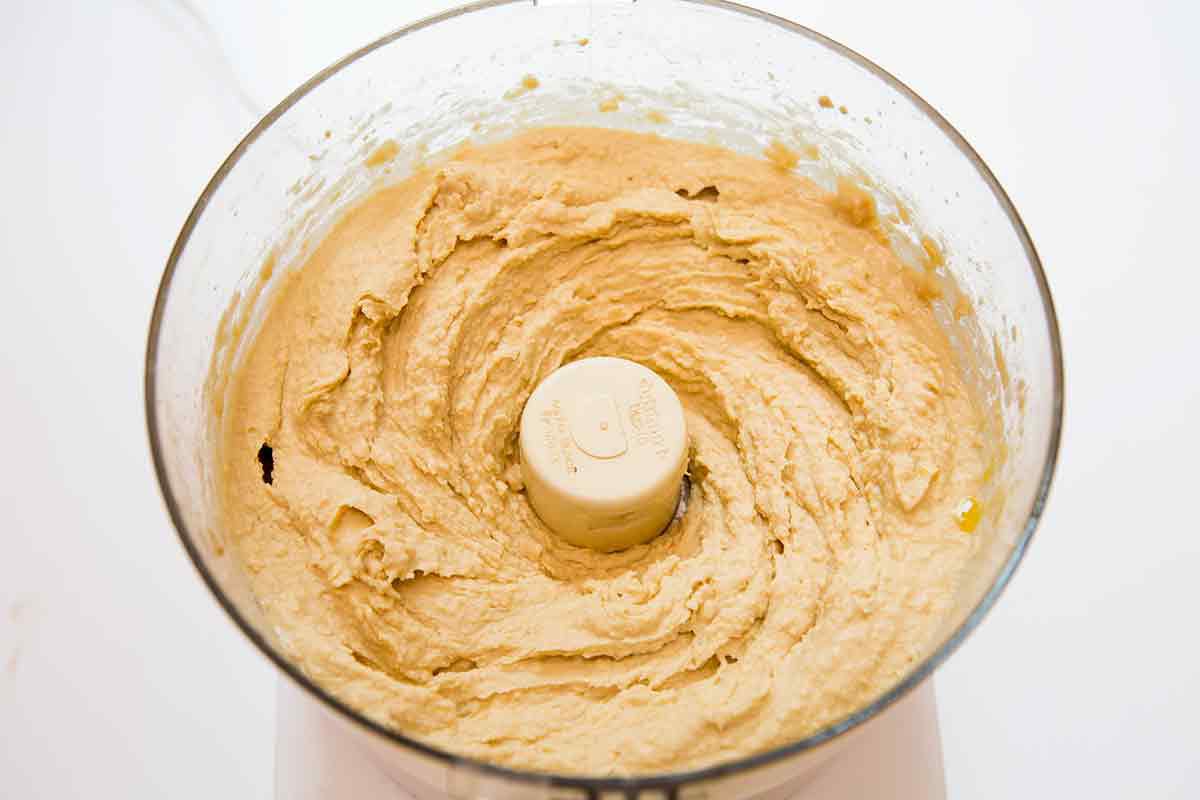 Blend the chickpeas, tahini, and olive oil until the hummus is creamy